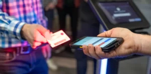Why Do Bars and Nightclubs Use ID Scanners? A Complete Guide to ID Verification & Venue Safety 3 Patronscan handheld ID scanner being used at an entry point